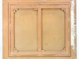 an old picture of a window with a wooden frame on it