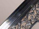a mirror that has a silver frame on it