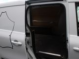a white van with the door open on the side of the road