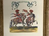 painting of two men riding horses in a gold frame on a wall