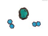 trois bijoux en turquoise et en pierre noire sur fond blanc