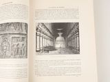 an open book with a picture of a building in it