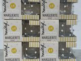 six boxes of marquette are stacked on top of each other