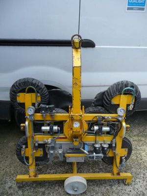 a white van with a yellow tow truck behind it