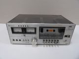 an image of a stereo tape recorder sitting on top of a white table