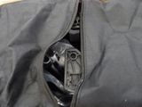 a black bag with a zipper on the inside of it
