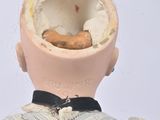 a doll with a broken head on a white background
