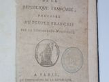 an old book with a picture of a statue on it