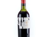 a bottle of wine that is sitting on a table