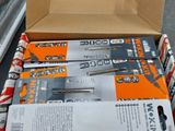 a box of tools sitting on the ground next to a car