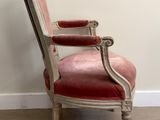 a chair that is sitting in the corner of a room