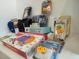 a lot of electronics on a table with a price tag