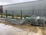 a lot of metal racks that are outside of a building