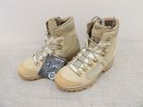 pair of beige hiking boots with a tag on the side of them