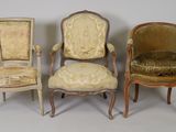 three antique chairs are lined up against a white background