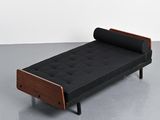 an image of a black and wood day bed