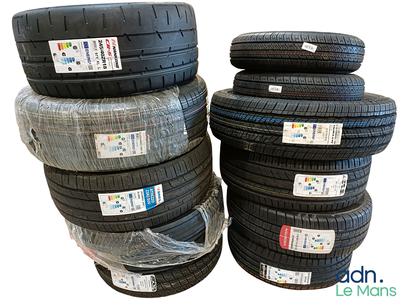 a lot of tires stacked on top of each other