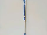 a close up of a pen on a white surface with a blue handle