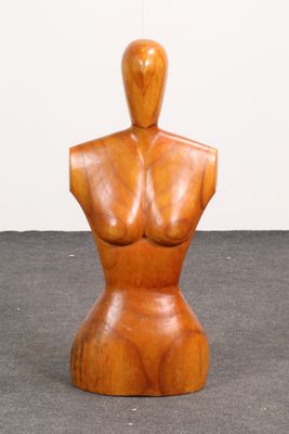 an image of a wooden mannequin sitting on top of a floor