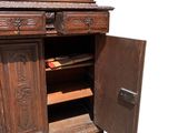 a wooden cabinet with a door open on a white background