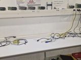 a white table with a bunch of wires on top of it