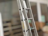 a ladder that is leaning against a wall in a room
