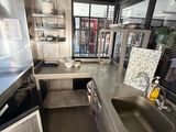 a kitchen with stainless steel appliances and a sink