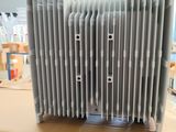a heater sitting on top of a cardboard box in a warehouse