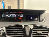 the dashboard of a car with a digital display in the center