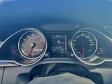 a close up of a car dashboard with a speedometer and gauges