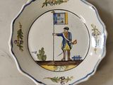 une image représentant une assiette sur laquelle figure un homme tenant un drapeau