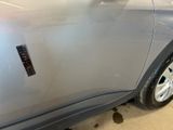 a close up of a car door with a sticker on it