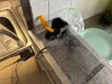 a plastic wrap on the counter top of a kitchen sink