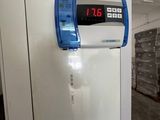 an image of a refrigerator with a digital clock on the door
