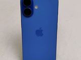 the back of a blue iphone case sitting on top of a table