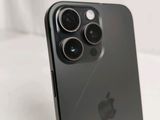 a close up of a black iphone with a camera on top of it
