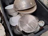 many plates and pans in a black box
