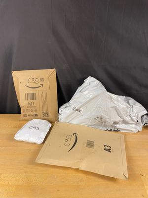 a box of white towels sitting on top of a wooden table