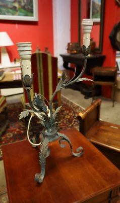 a small table with a candle on it in a living room