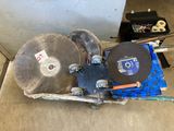 a machine that is sitting on the floor next to a box