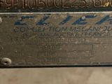 a close up of a piece of metal with a sign on it