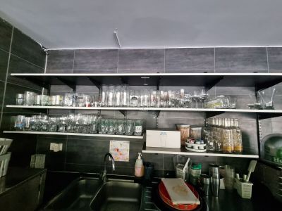 many glasses on the shelves in the kitchen