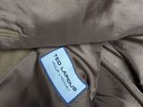 the back of a brown jacket with a blue label on it