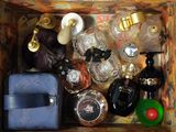 a wooden box filled with perfume bottles and a purse