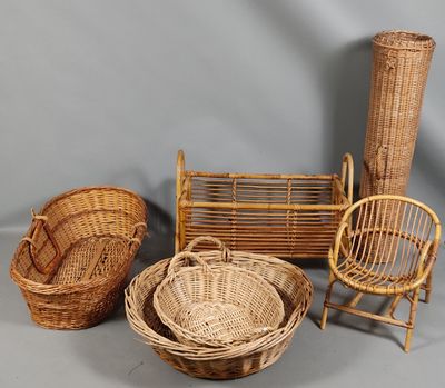 three wicker chairs, a basket, and a chair on a grey background