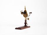 a small clock on a wooden stand on a white background