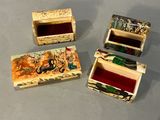 three small wooden boxes sitting on top of a table next to each other