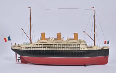 a model of a large boat on a white surface