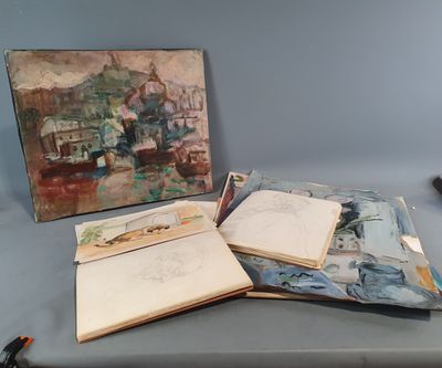 un livre ouvert posé sur une table, à côté d'un tableau