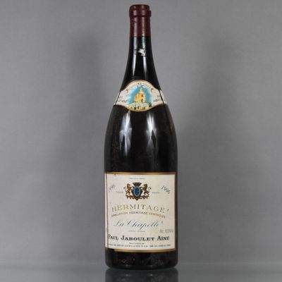 an image of a bottle of wine sitting on top of a table